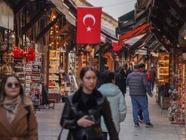 A Turkish national flag hangs above the Arasta Bazaar in Istanbul. Photographer: David Lombeida/Bloomberg