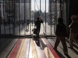 Shoppers walk down Nanjing East Road. Photographer: Qilai Shen/Bloomberg