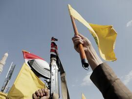 <p>Houthi followers brandish Lebanon's Hezbollah flags, on Sept. 27, 2024, in Sana'a, Yemen.</p>