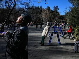 People exercises at a park in Beijing. Bloomberg Bloomberg