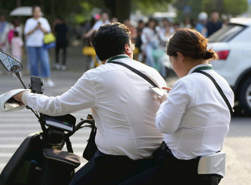 太めな人が目立つ北京市内。中国政府は生活習慣病を予防するキャンペーンを新たに展開する（２８日）＝大原一郎撮影