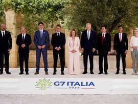 G-7 leaders pose for their family photo on June 13. Photographer: Christopher Furlong/Getty Images