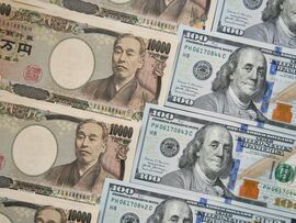 <p>Japanese 10,000 yen, left, and US 100 dollar banknotes arranged for a photograph in Tokyo, Japan</p>