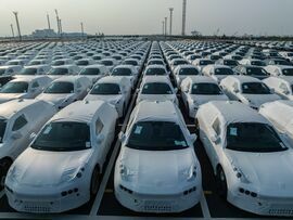 Electric vehicles bound for shipment to Europe at the Port of Taicang in China. Bloomberg