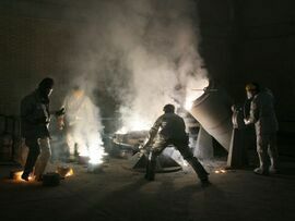 Workers inside of an uranium conversion facility outside Isfahan, Iran. Photographer: Getty Images/Getty Images