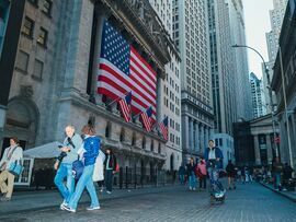 American flags at the New York Stock Exchange in New York. Photographer: Sara Konradi/Bloomberg