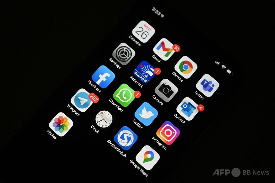 アプリのロゴが並ぶスマートフォンの画面（2021年5月26日撮影、資料写真）。【翻訳編集】 AFPBB News