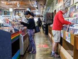 Shoppers browse albums at a record store in Atlanta, Georgia. Photographer: Dustin Chambers/Bloomberg