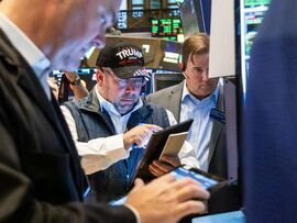 <p>A trader wearing a Trump hat </p>