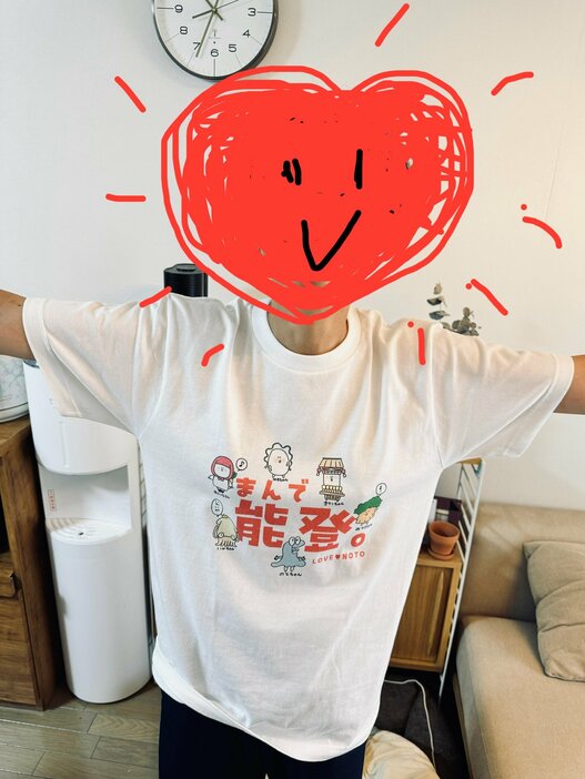 なとみさん作の復興Tシャツ「まんで能登T」。新しく広がった人脈「全国トラック協会」のイベントで販売