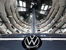 <p>A VW ID.7 electric automobile inside an Autostadt Car Tower at the Volkswagen AG headquarter</p>