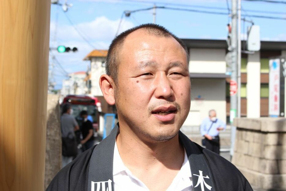 [写真]一の鳥居再建に奮闘した木又誠次さん