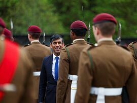Rishi Sunak inspects a passing out parade in Cattrick, England.