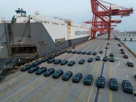 Electric vehicles bound for shipment to Europe at the Port of Taicang in Taicang, China. Bloomberg Bloomberg