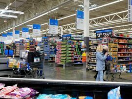 <p>Customers shop for groceries at a Walmart store in Secaucus, New Jersey, US</p>