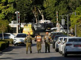 Israeli emergency workers attend the scene after the drone strike on Oct. 19, Photographer: Amir Levy/Getty Images Europe