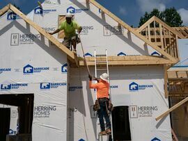 Workers build homes in Lillington, North Carolina. Photographer: Allison Joyce/Bloomberg