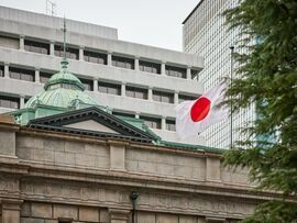 <p>A Japanese flag flies outside the Bank of Japan headquarters, March 14, 2024. </p>