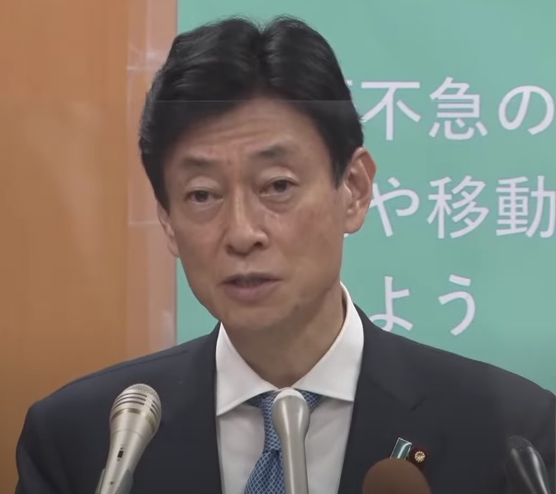 会見する西村担当相