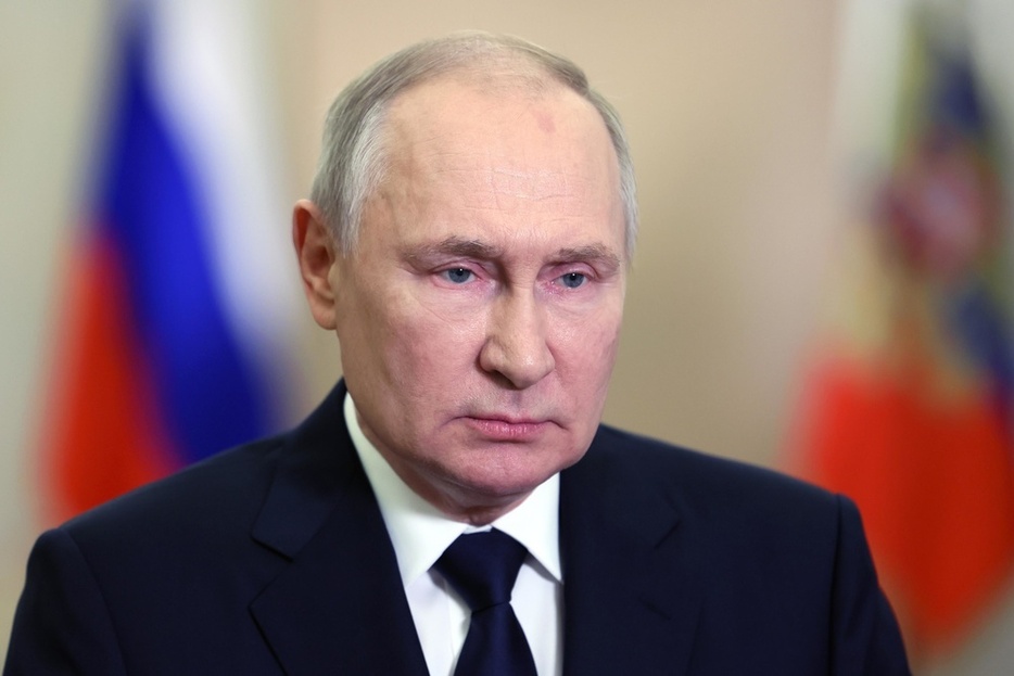 9月、ビデオ声明を発表するロシアのプーチン大統領（タス＝共同）