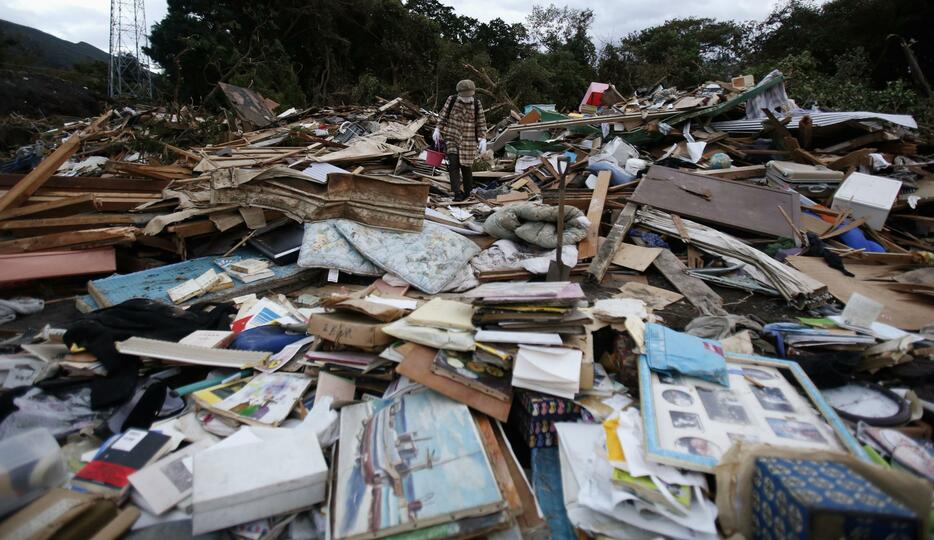 死者・行方不明者39人を出した2013年10月の伊豆大島土砂災害では、大雨特別警報は発表されていない（写真：ロイター/アフロ）