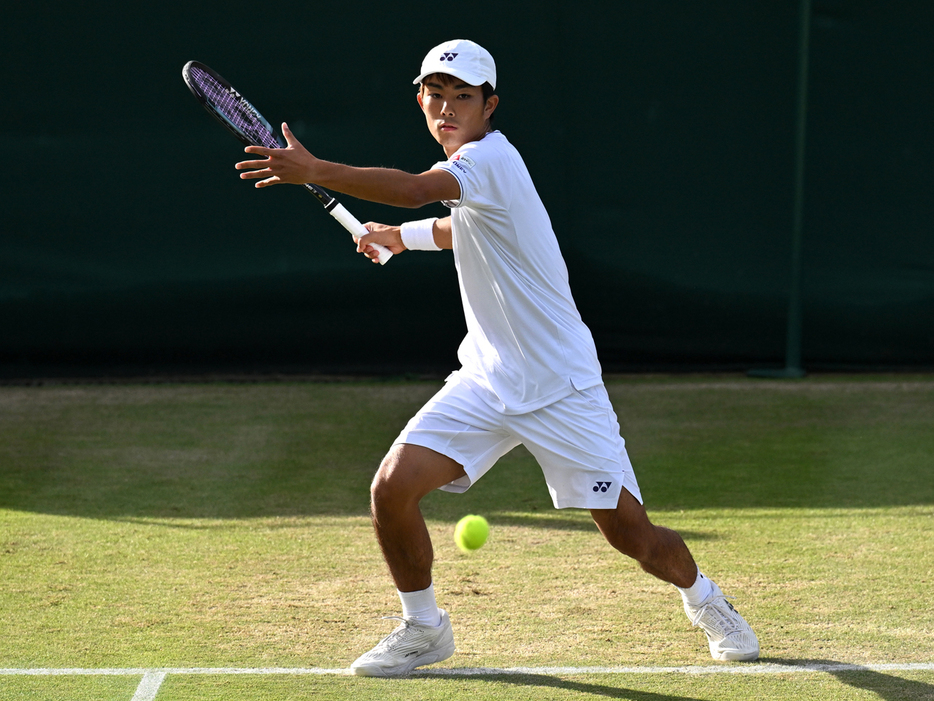 写真はジュニア男子シングルス1回戦での本田尚也（文星芸術大学附属高等学校）（Getty Images）