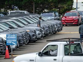 Customers at a Ford dealership in Colma, California.