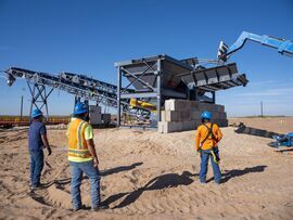 Workers at a loading area at a mining operation in Big Spring, Texas. Photographer: Matthew Busch/Bloomberg