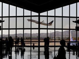 A passenger jet takes off from Phoenix Sky Harbor International Airport. Photographer: Patrick T. Fallon/Bloomberg