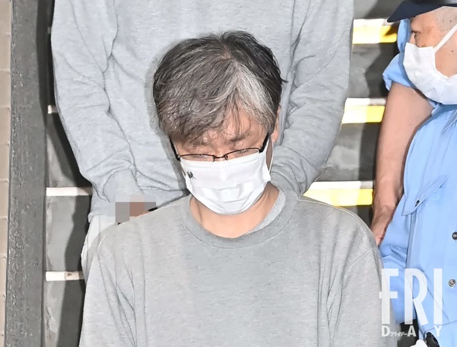 逮捕・送検される北村被告