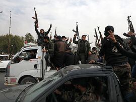 People celebrate the fall of the Syrian regime at Umayyad Square in Damascus, Syria on Dec. 8, 2024.