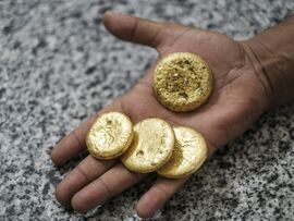 Pieces of gold displayed at a gold laboratory in Port Sudan, Sudan. Photographer: Eduardo Soteras/Bloomberg