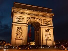 <p>The Arc de Triomphe lit at night in Paris, France. </p>