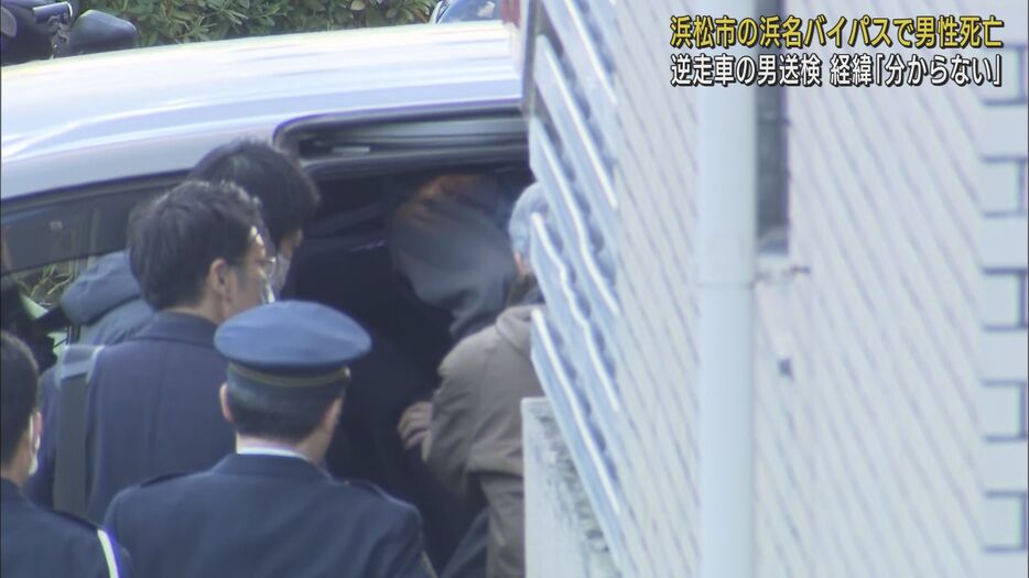 送検される容疑者